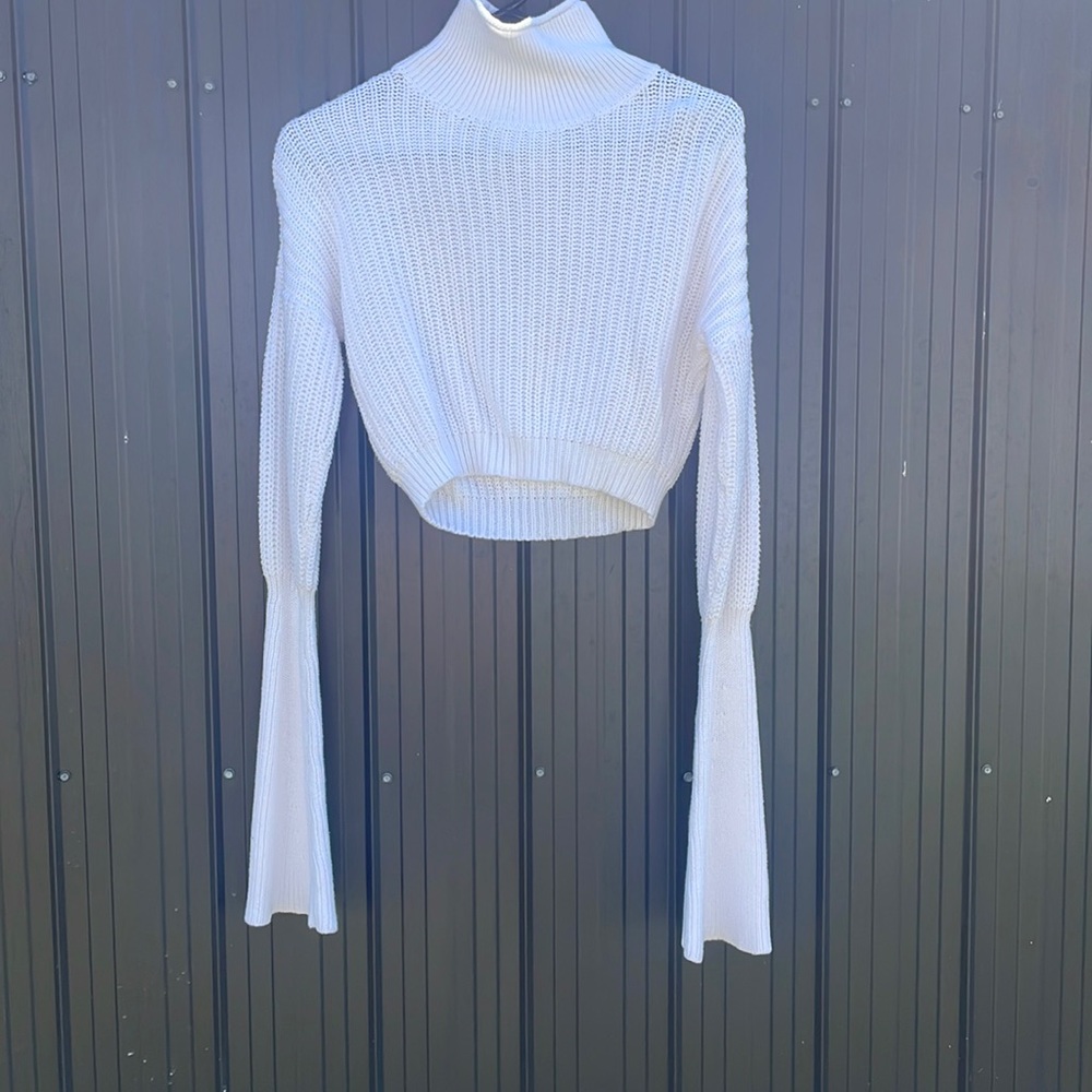 American Apparel crop turtle neck with bell like sleeves covers hands